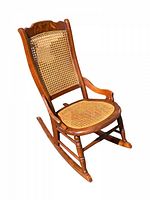 Side angle showing full child size wooden rocking chair with cane seat and cane backrest. The chair is in good vintage condition with visible turned legs and armrest detail.