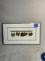 Framed artist proof etching showing five woven hanging baskets in brown tones by Martha Harrison.