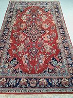 Full view of rug laid flat showing entire pattern and borders