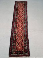 Full view of runner rug on white background