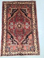 Full view of the hand knotted Persian rug showing overall pattern, colors and condition.