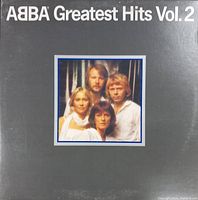 Front cover of the ABBA Greatest Hits Vol. 2 vinyl record showing band photo and album title.