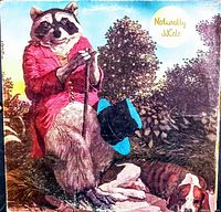 Album cover showing illustrated anthropomorphic raccoon and dog with title Naturally J Cale in good condition with some wear