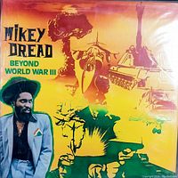 Front view of the vinyl record cover showing colorful military-themed artwork and a photo of Mikey Dread.