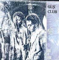Front cover of the vintage vinyl record by The Gun Club titled 'Fire of Love', showing a black and white textured photo of three men holding blades and the album title and band name printed on the right side.