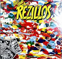 Front cover of a vintage vinyl record by The Rezillos with colorful abstract paint design and comic strip inserts.