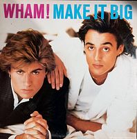 Photo of the Wham! Make It Big vintage vinyl record cover showing the two band members and the album title.