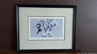 Framed signed Marc Barrie limited edition print showing whole artwork with winter chickadee perched on snowy branches.