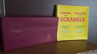 Yellow box labeled 'Turntable for Scrabble' in multiple languages, vintage style packaging