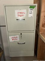 Full view of a metal filing cabinet with two drawers labeled 'STEALTH Singer' and 'FREEZE Blade'