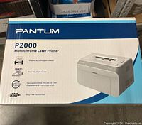 Boxed Pantum P2000 Monochrome Laser Printer showing front of box with branding and specs.