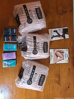 Photo showing three sealed packs of Depends XL adult diapers, four pantyhose boxes, and two tissue packs on a wooden surface.