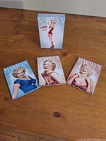 Full set slip cover of Marilyn Monroe: The Premiere Collection DVDs showing front design with Marilyn Monroe in red outfit.