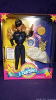 Barbie Police Officer doll in original box, showing front to highlight packaging and doll details.