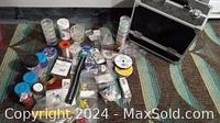 Overview photo showing contents of jewelry making kit including beads, wire spools, containers, and storage case arranged on surface