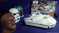 Star Wars masks and Millennium Falcon model with Galactic Destroyer box set in background