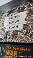 Front cover of the vintage tattoo flash art book showing title and tattoo flash design collage