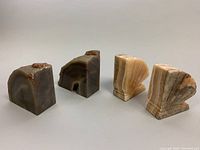 Pair of geode and onyx stone bookends shown with natural shape and polished fan shape.