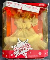 Front view of the Barbie doll in original display box with visible wear and crushing on the box.