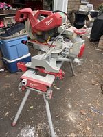 Saw and stand assembled together, front-left view