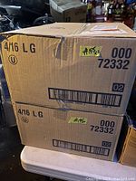Two cardboard boxes stacked with labels indicating '4/16 LG' and product code 000 72332