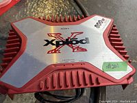 Red and silver Sony Xplod car amplifier showing top with branding and 800W power rating.