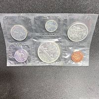 Full view of the 1963 Canadian coin set in original sealed plastic package showing six coins in individual compartments.