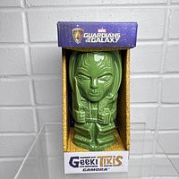 Front view of green ceramic Gamora tiki mug in original box with Guardians of the Galaxy branding.