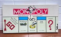 Front view of the sealed vintage Monopoly game box featuring the Monopoly logo and game board details.