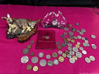 Photo showing the entire lot with the kangaroo clay resin figurine on wood base to the left, the crystal clock in Australia shape in center back, and the coins spread out with display case in front center.