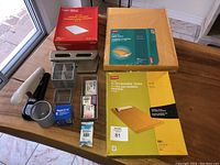 Overview photo showing hole punch, metal desk organizers, packages of staples, and package of bubble mailers.