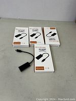 5 USB C to HDMI adapters with boxes and one adapter out of the box.