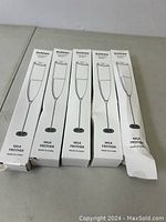 Five white boxed Dutewo Milk Frothers arranged side-by-side showing front packaging with product image and ‘Milk Frother’ label.