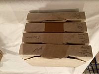 Four boxed Edwin Knowles plates stacked, boxes lightly worn but all original packaging.