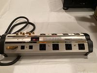 Top and front view of the Monster Power HTS 1000MKII power tap showing outlets, power switch and connectors