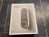 Closed box showing the Nest Hello video doorbell image and branding on front.