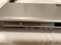 Close-up of the front panel of the Pioneer DV-285 DVD player showing control buttons and WMA/MP3 labeling