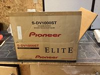 Closed box labeled Pioneer Elite S-DV1000ST speaker system.