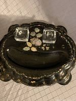 Top down photo showing black lacquered ink well desk set with mother of pearl inlay and two glass ink wells in place.