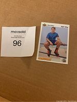 Photo of Pavel Bure rookie card with MaxSold lot number 96 beside it for identification.