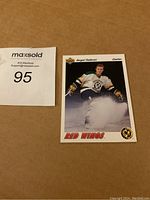 Front view of the Sergei Fedorov Upper Deck rookie hockey card showing the player skating on ice with red wings logos and team text.