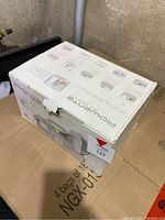 Closed original Rowenta steamer box with product images and instructions visible on the sides.