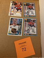 Four Patrick Roy hockey cards laid out on cardboard: two 1992 Pro Set Game Against Average, one 1992 Pro Set card, and one 1993 Upper Deck All-Star card.