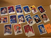 Photo shows 16 Upper Deck hockey portrait cards from 1992 featuring various NHL players in action or posed portraits with team uniforms.