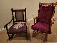 Both rocking chairs displayed side by side, showing overall design, upholstery and cushions.