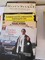 Stack of vinyl albums with Placido Domingo and Isaac Stern prominently visible including English Chamber Orchestra conducted by Julius Rudel, and featuring Salzburg recital by Kathleen Battle and James Levine.