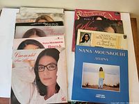 Top view showing album covers of Nana Mouskouri vinyl records, including 'Athina' and 'Songs of the British Isles'