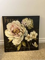 Full view of the French-themed botanical print on canvas showing large flowers and 'FRANCE' text.