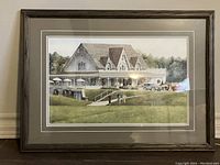Full view of framed golf-themed print depicting a golf clubhouse with people and vintage cars.