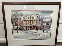 Full front view of the framed poster showing the artwork and frame details.